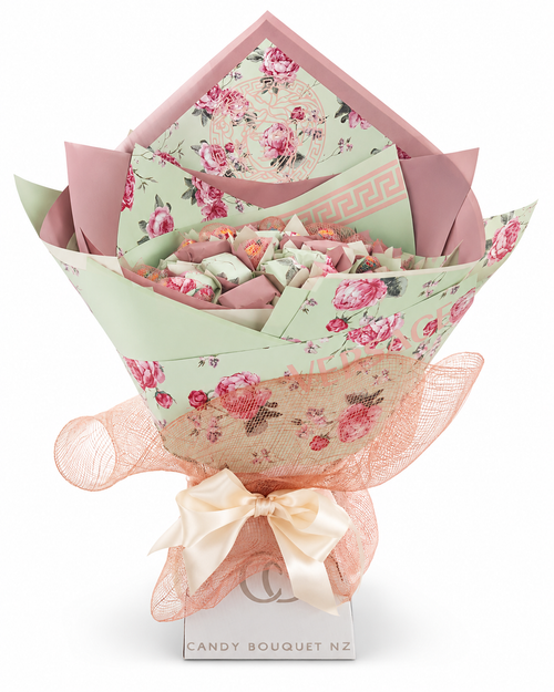 Versace-inspired Candy Bouquet NZ product bouquet in mint green and blush pink with floral wrapping, Greek key details and Medusa motif